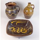 Three items of slipware - jug, flagon and rectangular dish