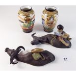 Two Japanese pottery buffalo and boy groups and a pair of late Satsuma vases 9cm tall