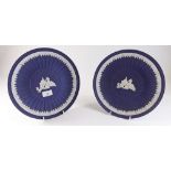 A large pair of dark blue Wedgwood Jasperware plates decorated children - 26.5cm dia