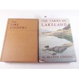 The Tarns of Lakeland by W Heaton Cooper, with 16 colour plates, together with The Lake Counties