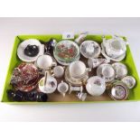 A quantity of miniature porcelain tea wares including Coalport and Spode