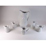 A group of five Portmeirion Parian Ware jugs and a large British Heritage jug