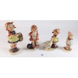 Four Hummel figures of children