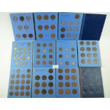 A quantity of ten coin folders containing pre-decimal halfpennies, pennies and brass threepences,