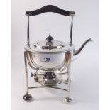 A silver plated spirit kettle on stand with bun feet