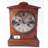 An oak 1920's/30's eight day striking mantel clock