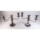 A pair of silver plated three branch candelabra