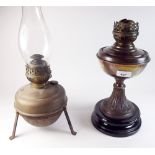 A Victorian copper oil lamp and a brass one