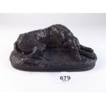 A bronze finish reclining hound on oval base - 15cm long, probably Heredities