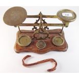 A Victorian set of old postal scales and weights with engraved decoration and a copper butchers
