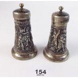 A pair of mid 19th century Persian cast silver pepper pots - 127g