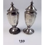 A pair of silver pepper pots - Chester 1902