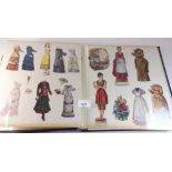 An album containing ephemera: 'Dress the Dolly' Victorian ladies and childrens clothing; Named black