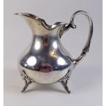 A continental silver cream jug with foliate feet 130g