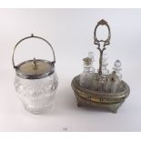 A good 19th century cut glass and silver plated biscuit jar and a cruet stand with matched set of