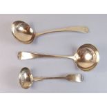 A pair of Georgian silver sauce ladles 1814 and a later Victorian one, 100g