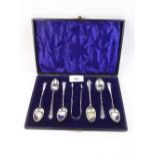 A part set of five silver teaspoons and tongs - cased