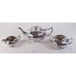 A silver plated three piece faceted tea set