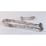 A pair of early 19th century silver shell bowl sugar tongs and a pair of small claw sugar tongs