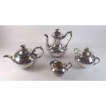 A Christofle silver plated Art Nouveau four piece tea service with floral finials