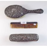 A silver backed brush, comb and clothes brush