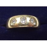 An 18 carat gold ring set three diamonds, size P
