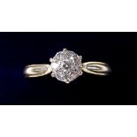 An 18 carat gold diamond set cluster ring - size R 1/2