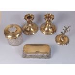 A five piece silver dressing table set comprising ring tree, net jar, trinket box and two