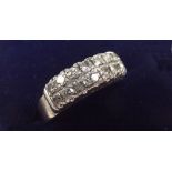 A white gold diamond ring set two rows of diamonds, size N