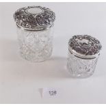 Two cut glass and silver topped toiletry jars - London 1900 and Birmingham 1902