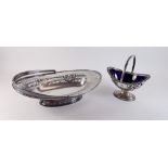 A silver plated sugar bowl with blue glass liner and a cake basket