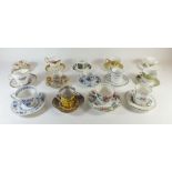 A collection of decorative coffee cups and saucers
