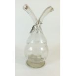 A vintage French glass oil and vinegar bottle