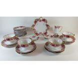 A Rosenthal part tea set in a rose border pattern consisting of: four trios, four pin dishes, milk
