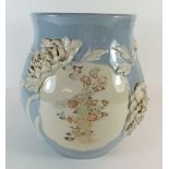 A Japanese Satsuma powder blue vase with white floral relief decoration and painted panels - 23cm