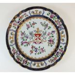 A 19th century French porcelain plate by Samson in the Chinese export armorial style with pseudo