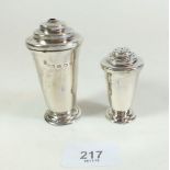 A small silver salt shaker and another larger one both by Roberts and Belk, Sheffield 1940 - 88g