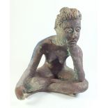 A ceramic sculpture of a seated girl 21cm