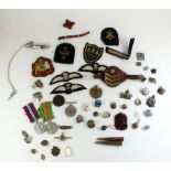 A box of WWII medals and military badges