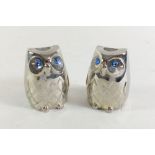 A pair of novelty chrome salt and pepper pots in the form of owls