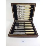 A late 19th century set of six fish knives and forks with EPNS blades and ivory handles