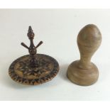 A treen butter stamp and a Victorian Tunbridgeware ring stand