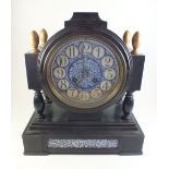 A Victorian mantel clock with blue and white porcelain dial