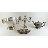A silver plated punch bowl, cruet stand, teapot and candelabra