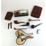 A box of smoking collectables including pipes, leather cigar wallets, pipe cutter etc