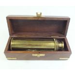 A brass four draw telescope - cased