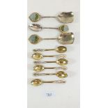 A group of vintage tennis related spoons together with gilt Thai spoons