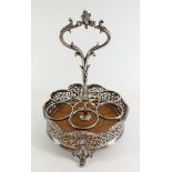 A 19th century silver plated Elkingtons cruet stand on scrollwork feet