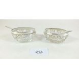 A pair of silver and cut glass salts with spoons (1 spoon plated)