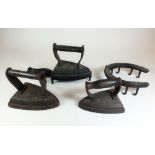 Three Victorian flat irons, iron trivet and horseshoe trivet